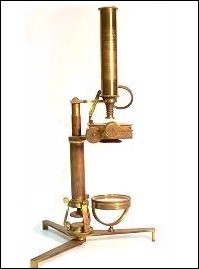 Microscope with 3 scroll supports on a folding tripod base c. 1840