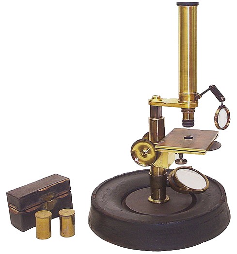 J & W Grunow, New York, serial number 267. Small microscope on a round iron and wood base. c. 1864
